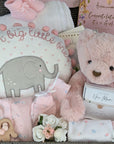 a large new mum hamper basket which includes chocolates, bracelet, reddy bear, teething toy, clothing set, blanket, booties and keepsake basket.