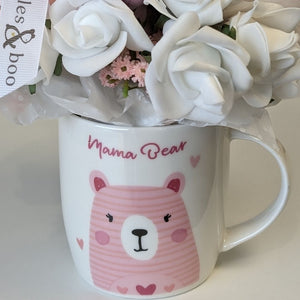 new mum gifts bouquet which includes mittens, socks and bandana bibs.