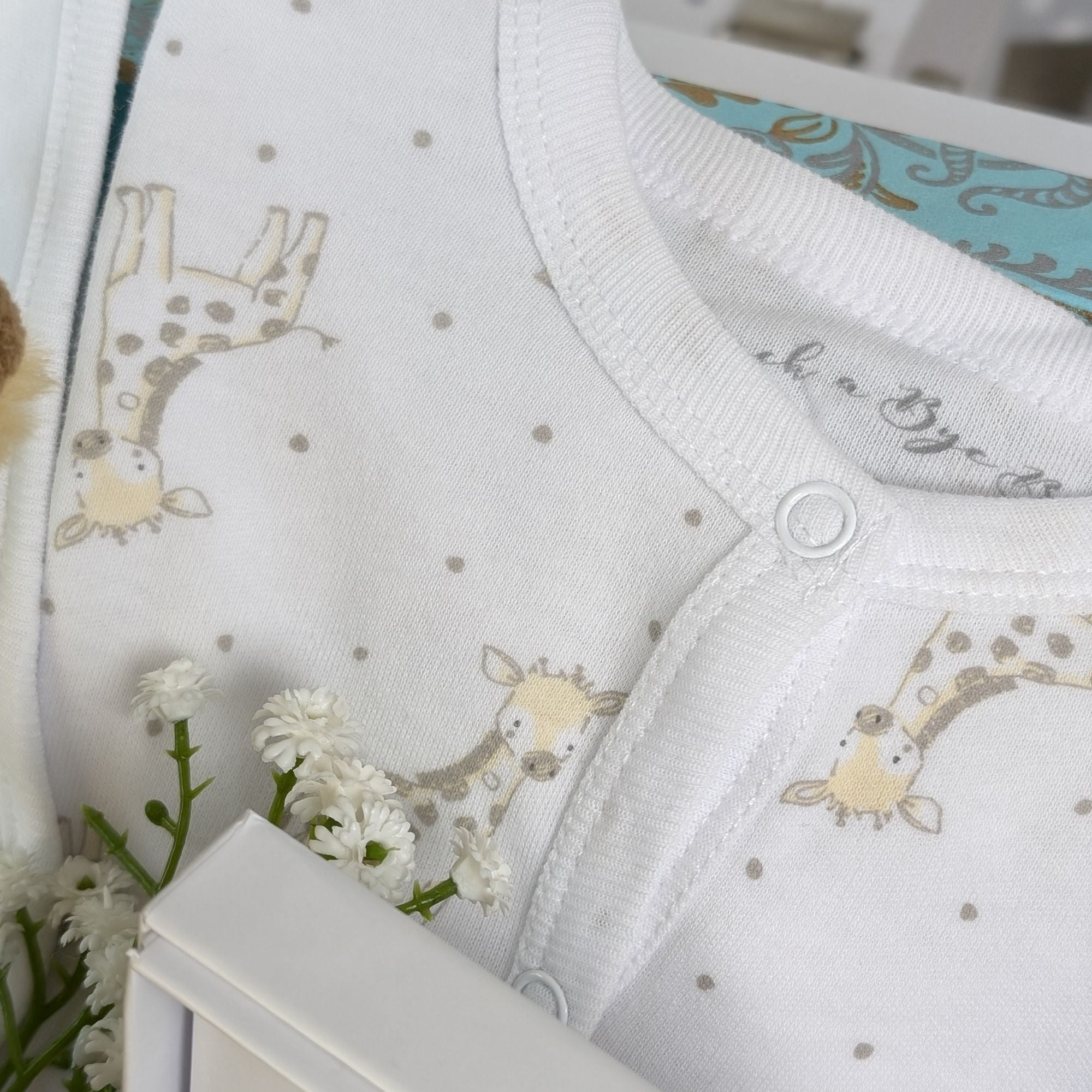 giraffe theme baby clothing in soft cotton with yellow giraffes on