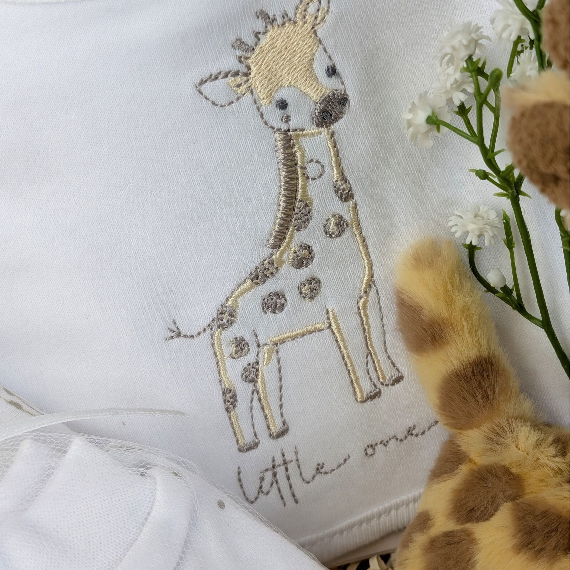 giraffe new baby clothing set with a yellow embroidered giraffe