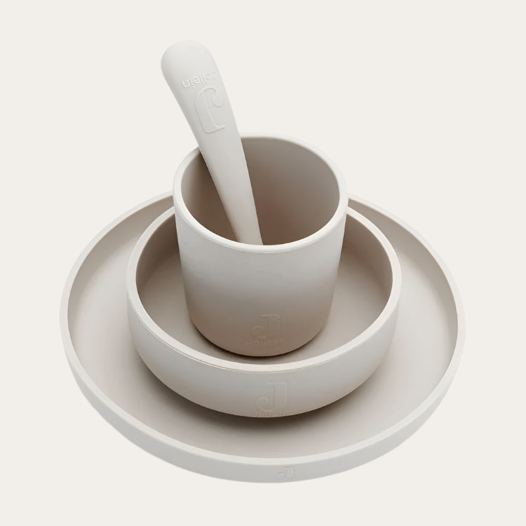 Children’s Silicone Tableware Set in nougat, including a suction plate, bowl, spoon, and cup.