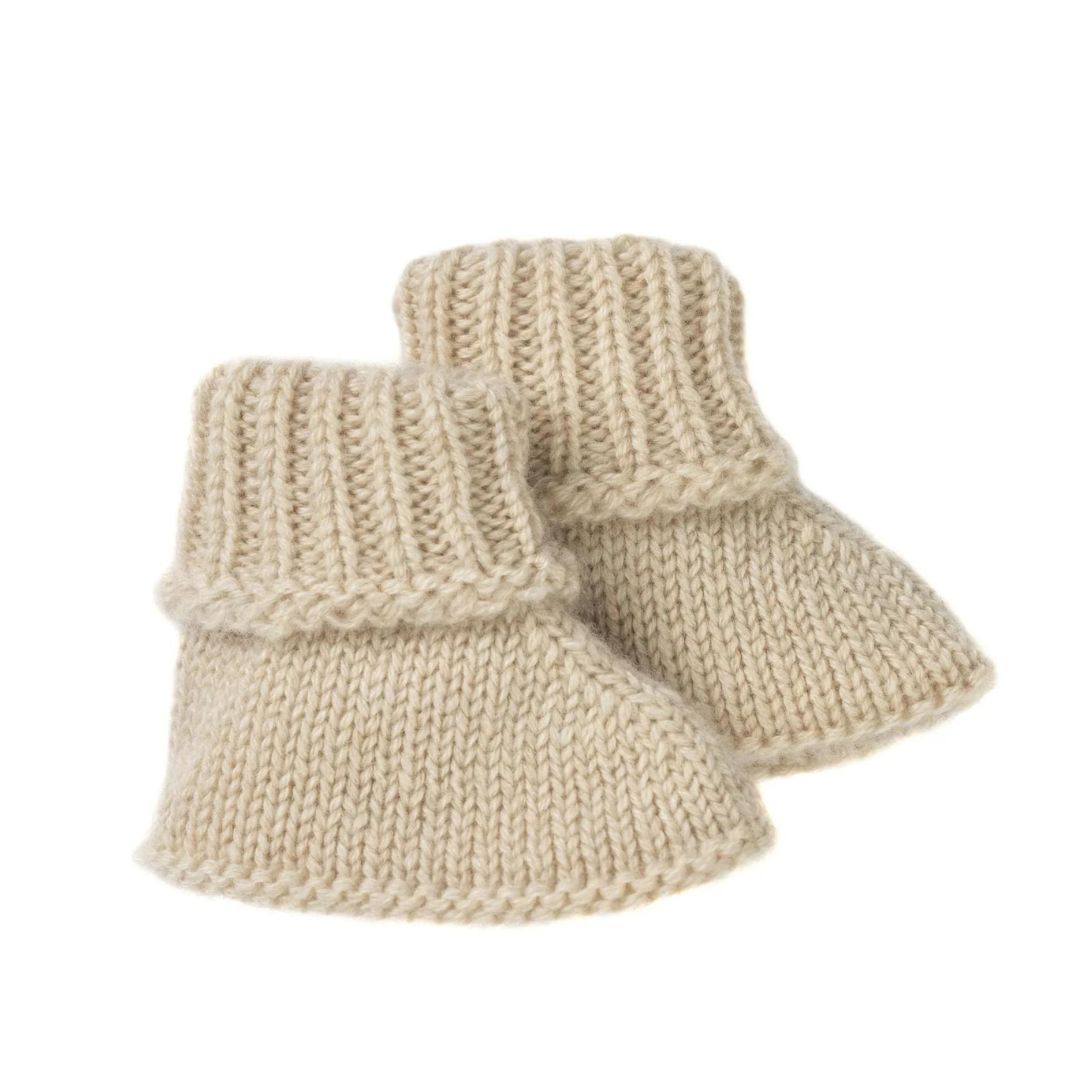 Soft pair of cashmere booties in an oat neutral unisex colour