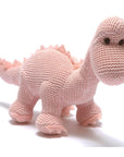 organic dinosaur soft toy in pink.