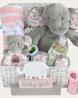 personalised baby girl gifts basket with elephants and blanket, packed in a white hamper basket.