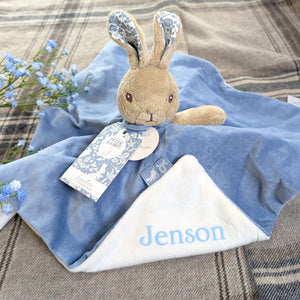 peter rabbit baby comforter in blue which can be personalised with baby's name