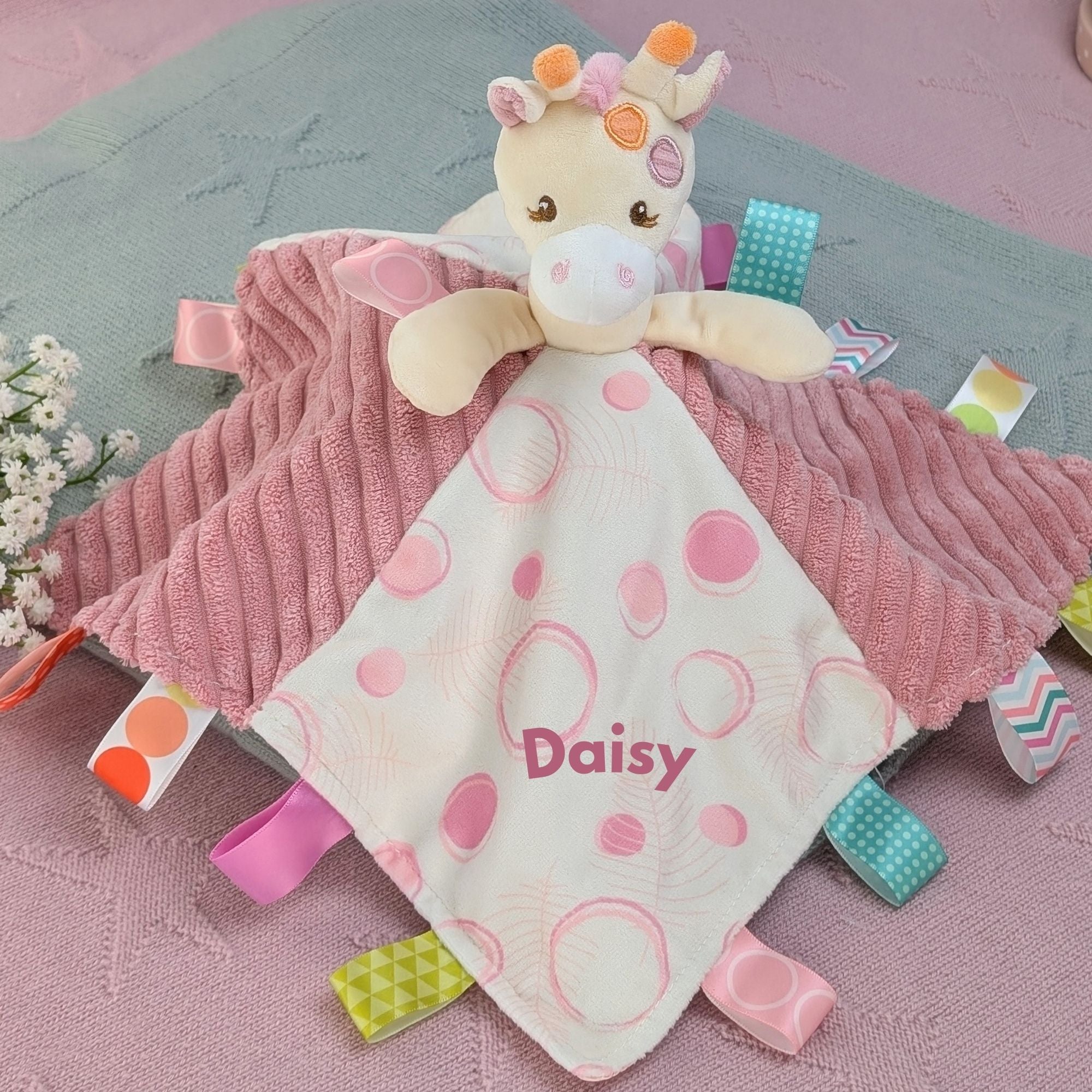personalised tilly giraffe comforter with tags for sensory play. pink giraffe.