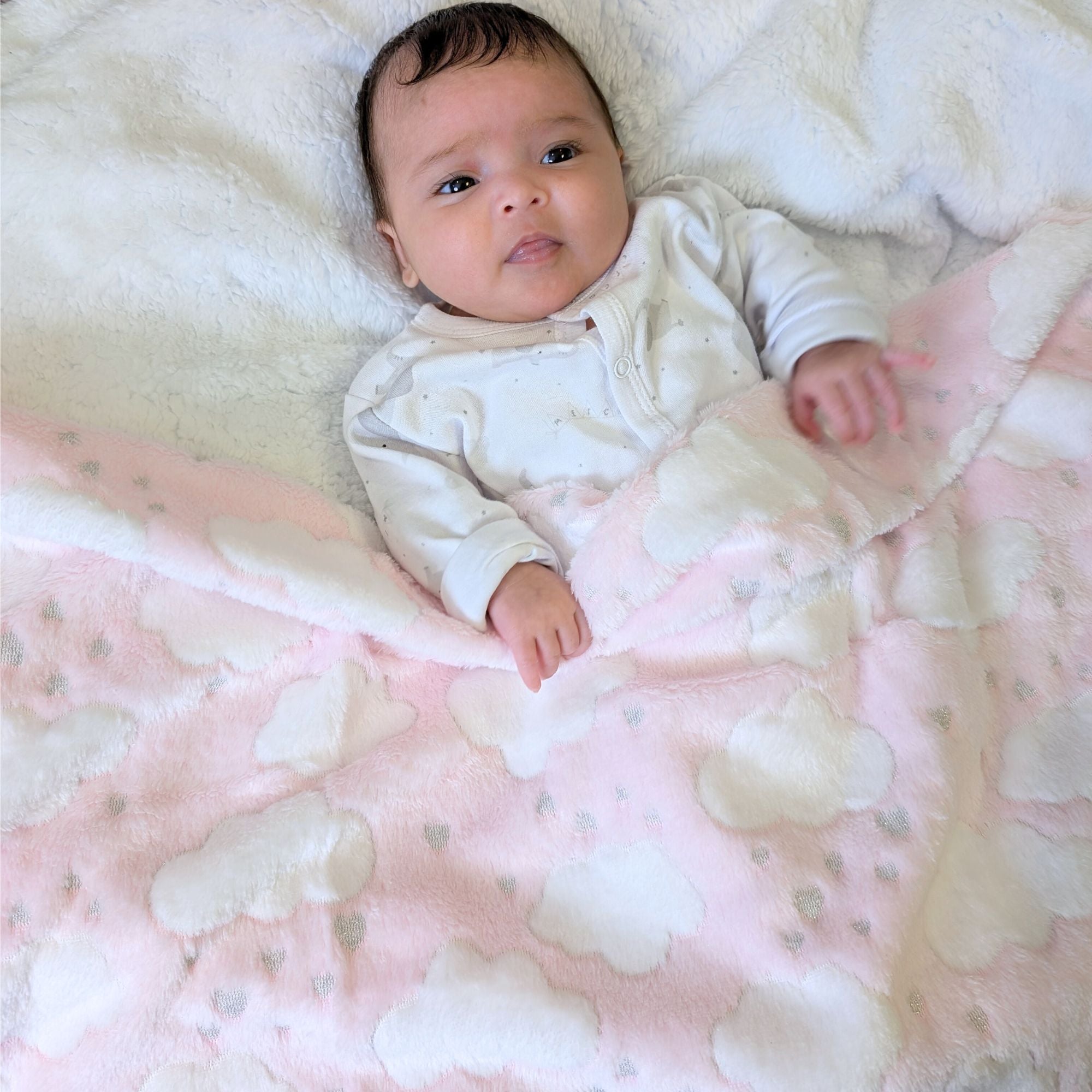 Soft pink baby blanket wrap with a white cloud pattern bumbles and boo