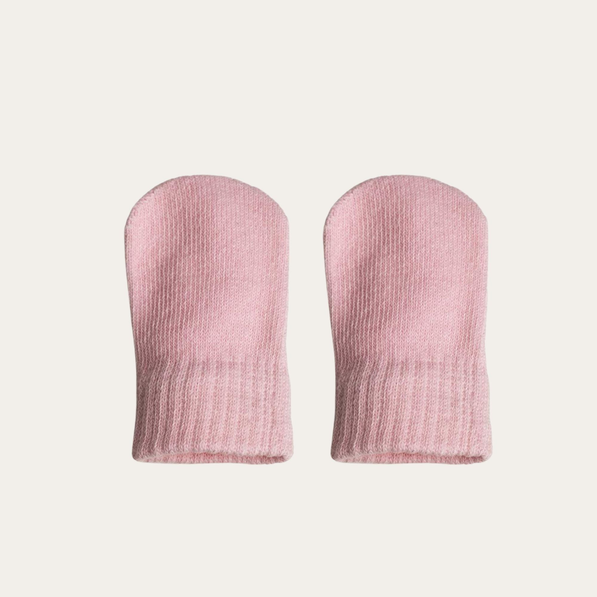 A pair of 100% brushed cotton mittens in a soft light pink