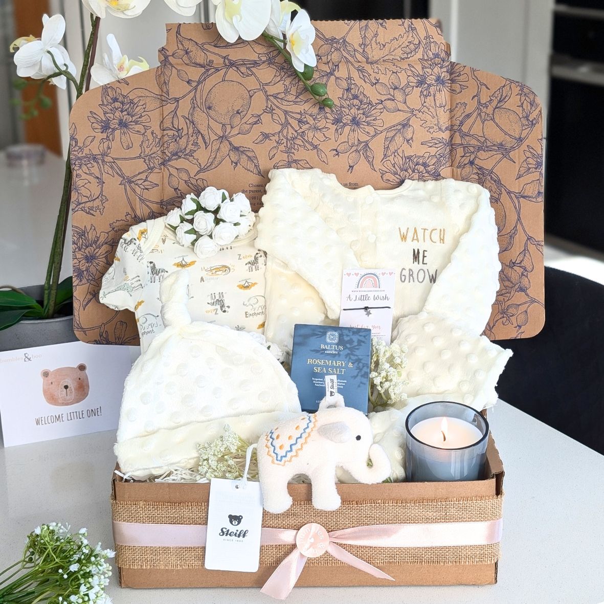 new baby gift box with steiff lamb, baby clothing set and candle for mum. Bumbles and Boo.