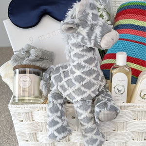 pregnancy gifts hamper basket with grey giraffe, baby journal, baby blanket, eye mask and organic baby wash.