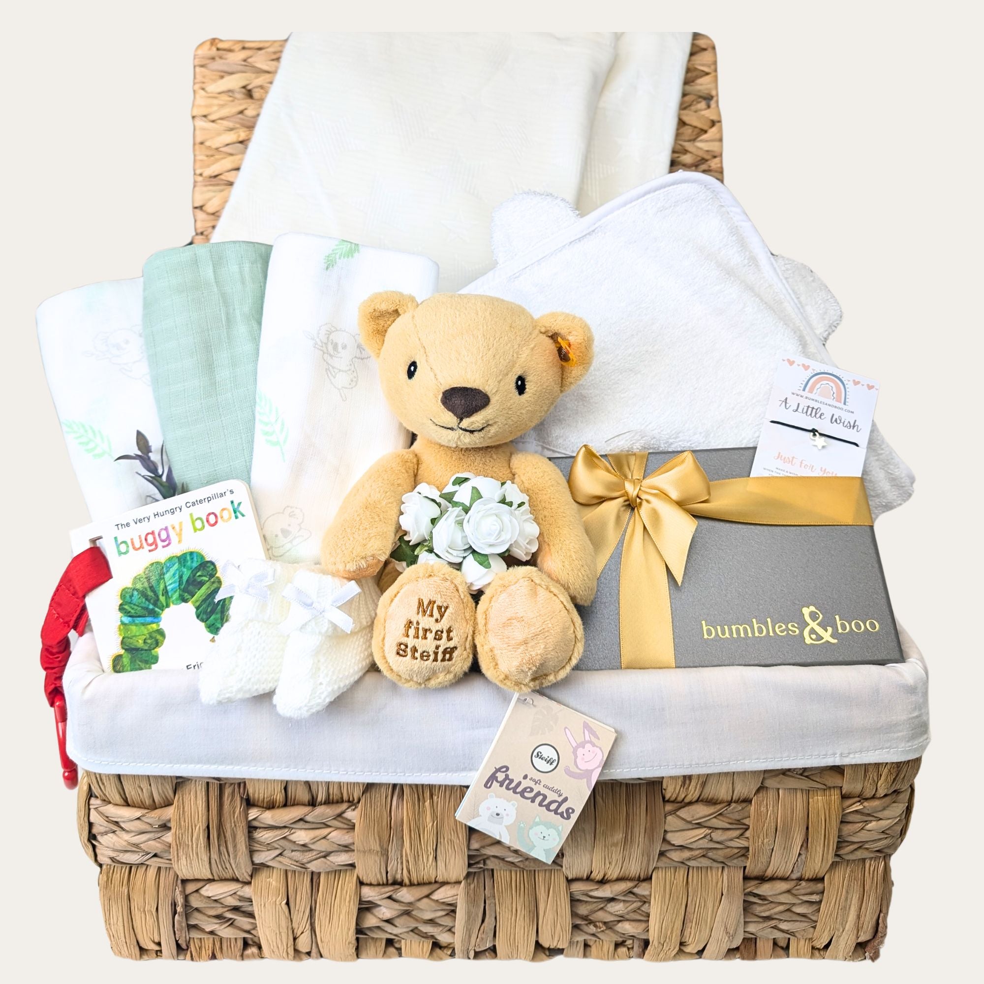 pregnancy hamper for a mum to be with baby blanket, muslin squares, hooded bath towel, teddy, booties and chocolates for the parents to be. Bumbles and Boo