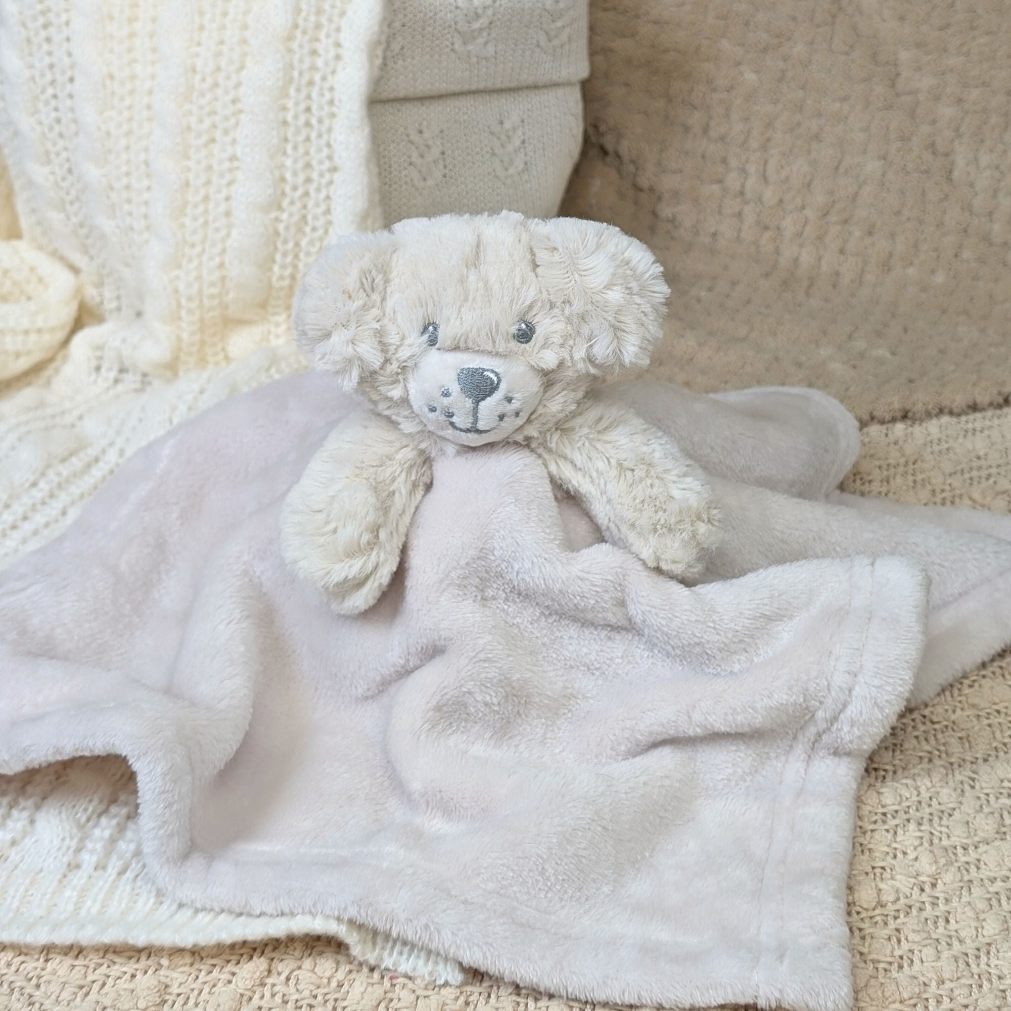 Soft comforter soother toy in a cream unisex colour with an adorable puppy fluffy feel face. bumbles and boo.