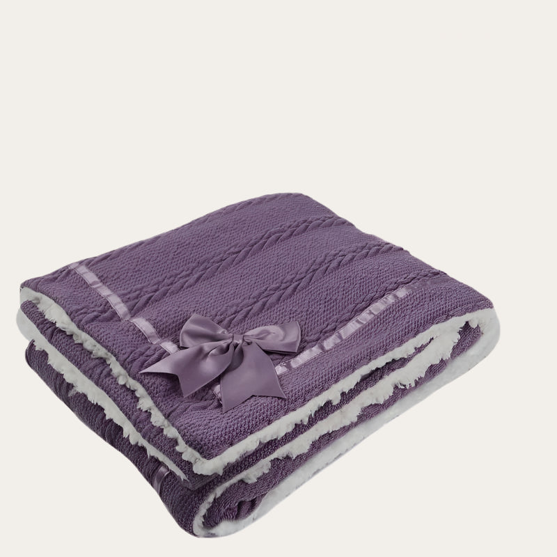 Purple Sherpa Back Knit Blanket folded neatly, showing the satin bow