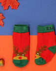 A pair of mainly red casks with a green anlkle band with a festive reindeer face o n the front