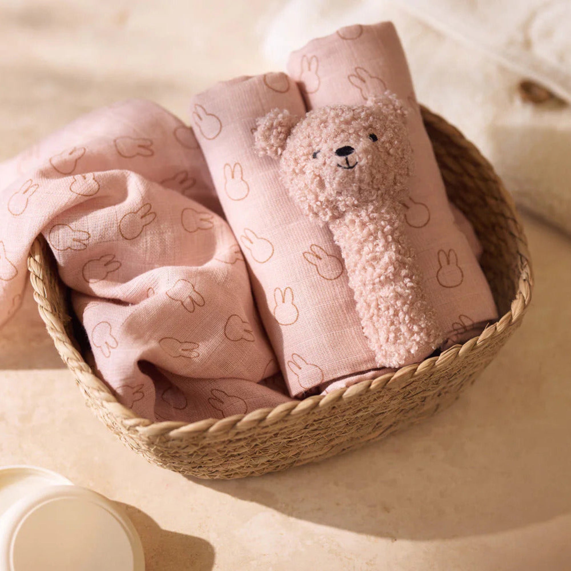 Teddy Bear Rattle in rose pink, with a soft bell inside the head and a cuddly, baby-friendly design.