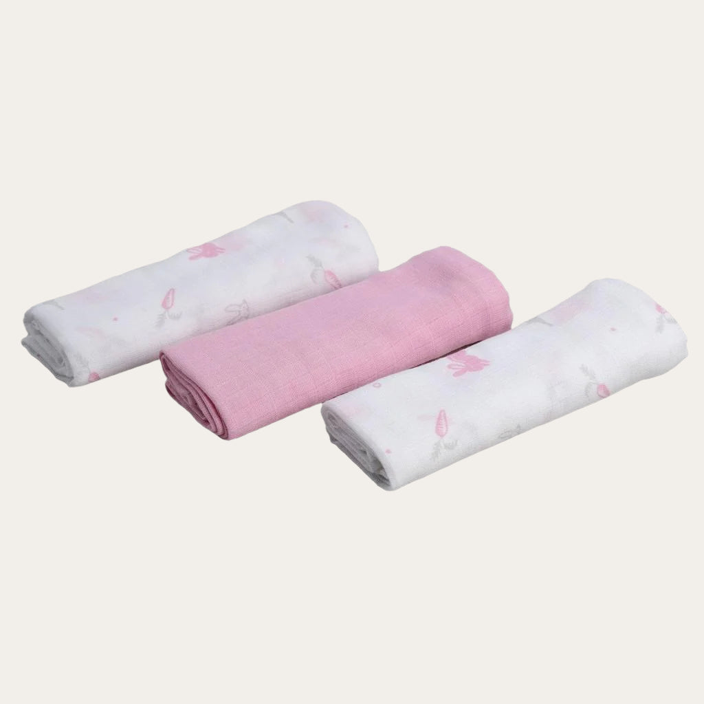 Set of 3 pink Woven Muslin Squares folded neatly.