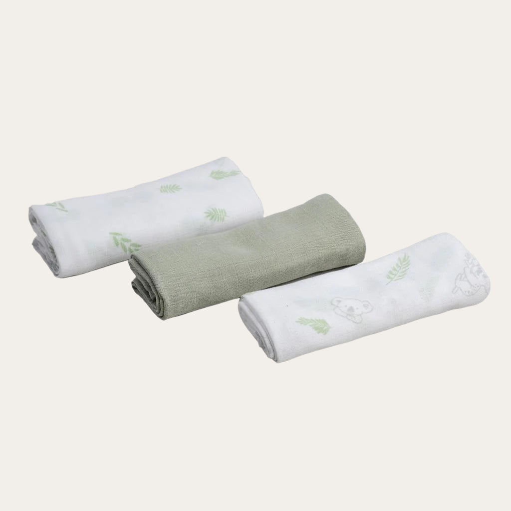 Set of 3 Sage Green Woven Muslin Squares folded neatly.