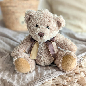 sherwood teddy bear in brown with a bow around his neck