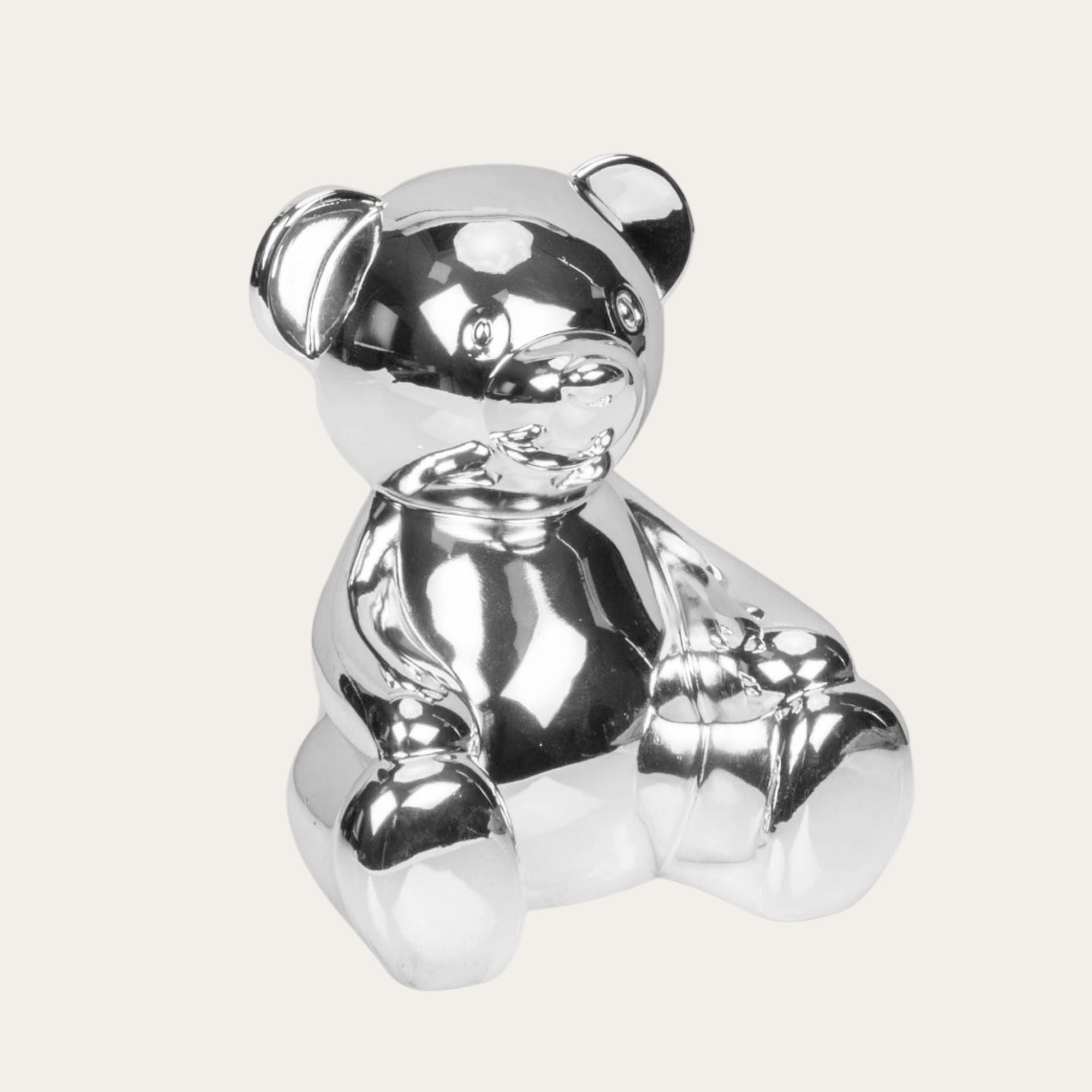 Silver plated teddy money box. with money slot and bung at base.