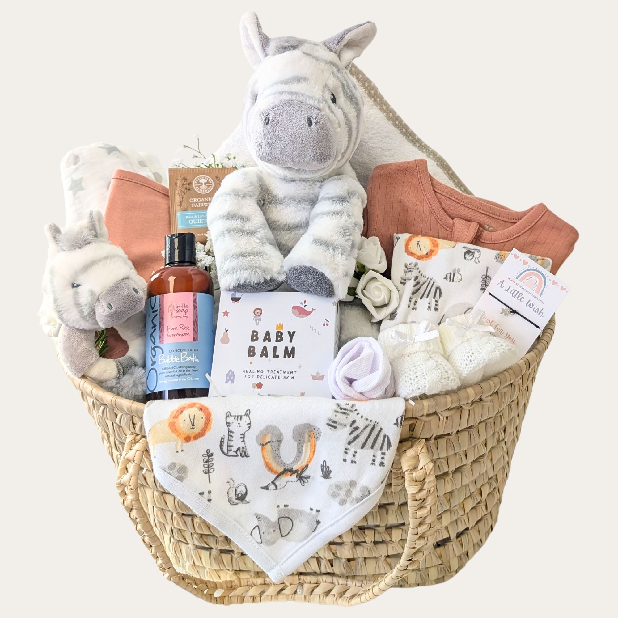 safari themed new baby gifts basket with zebra soft toy clothing set muslin baby booties and baby rattle bumbles and boo