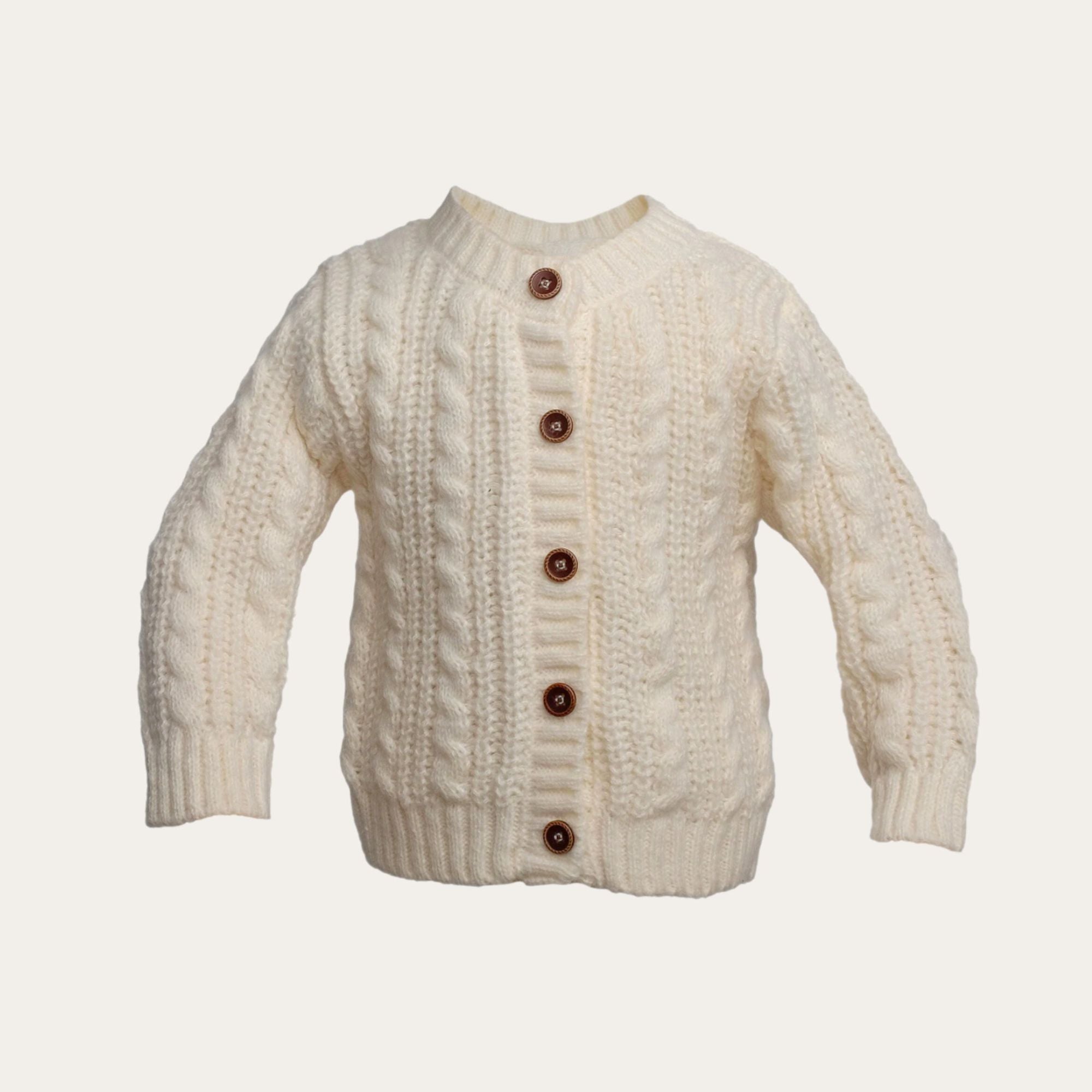 Long sleeved cream knitted cardigan for babies – classic and cosy