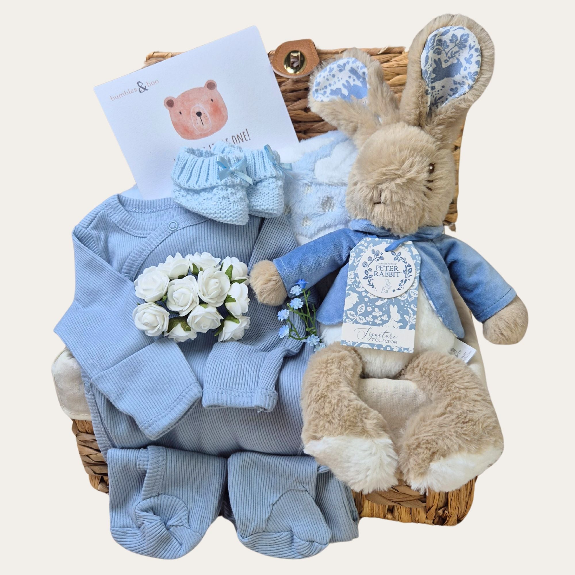 Baby boy gifts hamper with Peter Rabbit theme and blue blanket and blue sleepsuit. Bumbles and Boo. 