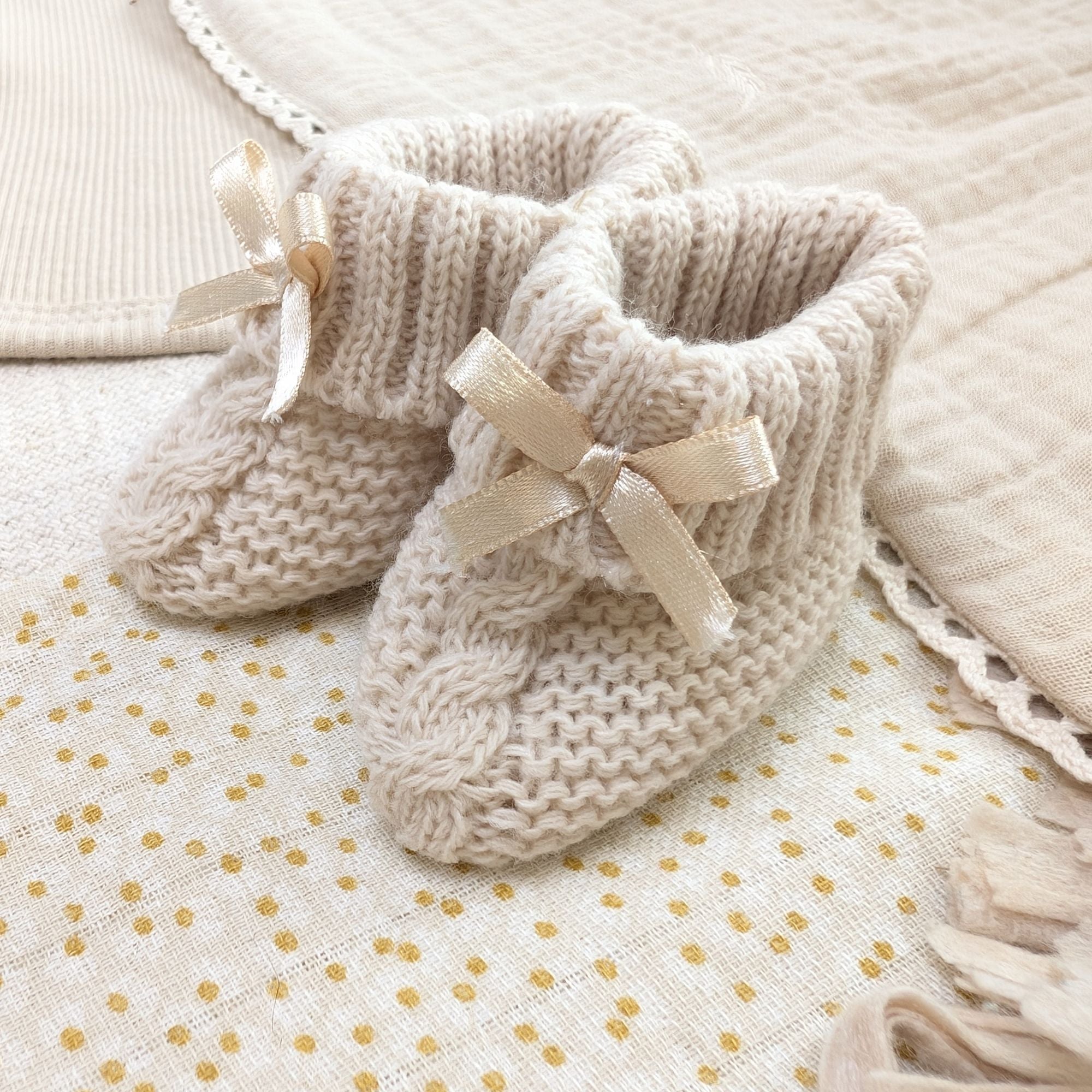 baby knit booties in biscuit colour