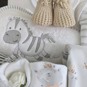 new baby hamper gift. Clothing set to include bib, vest, romper and hat. Elephant baby hand rattle, zebra hooded bath towel and baby mittens.