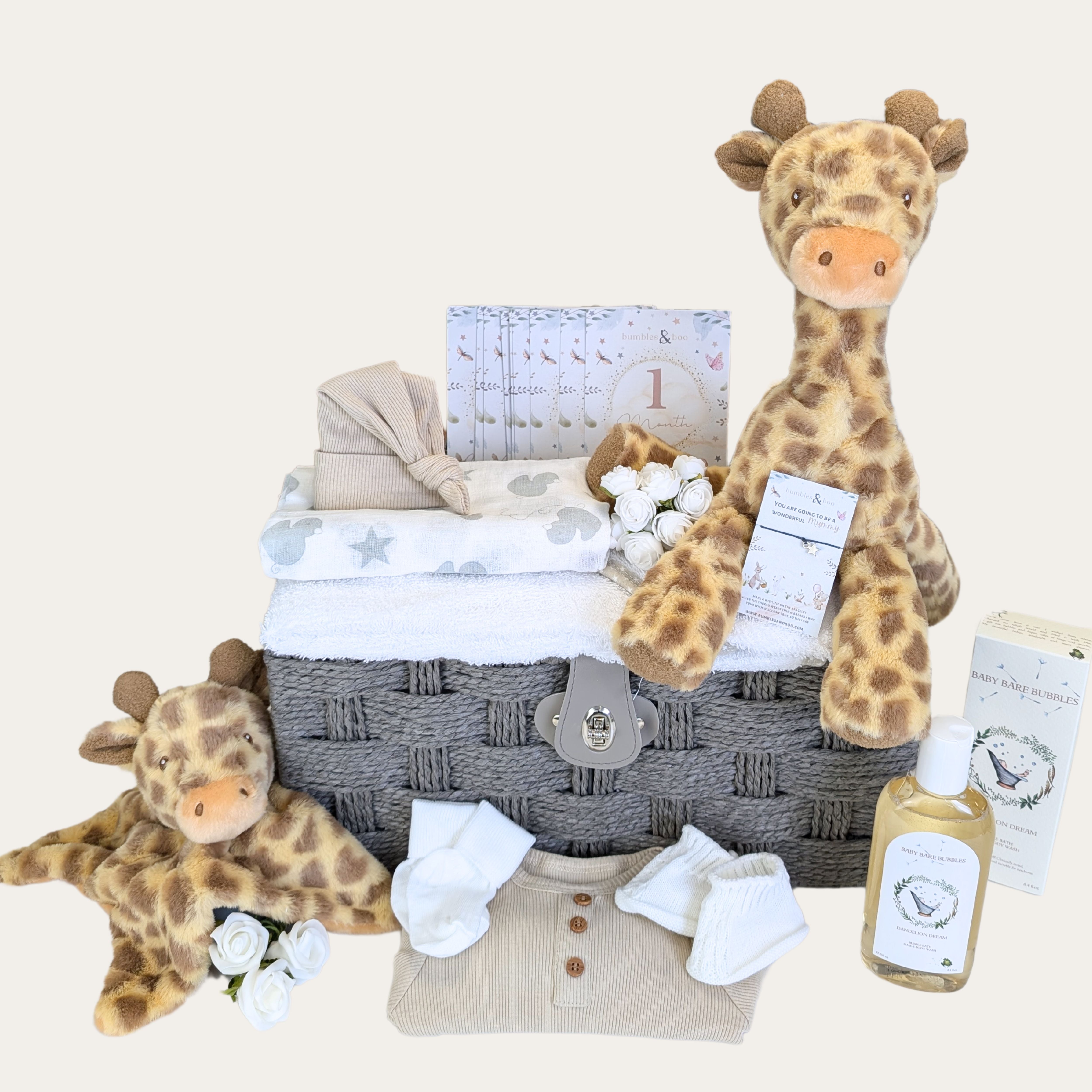 giraffe themed new baby gift hamper with hooded towel clothing and baby 
skincare