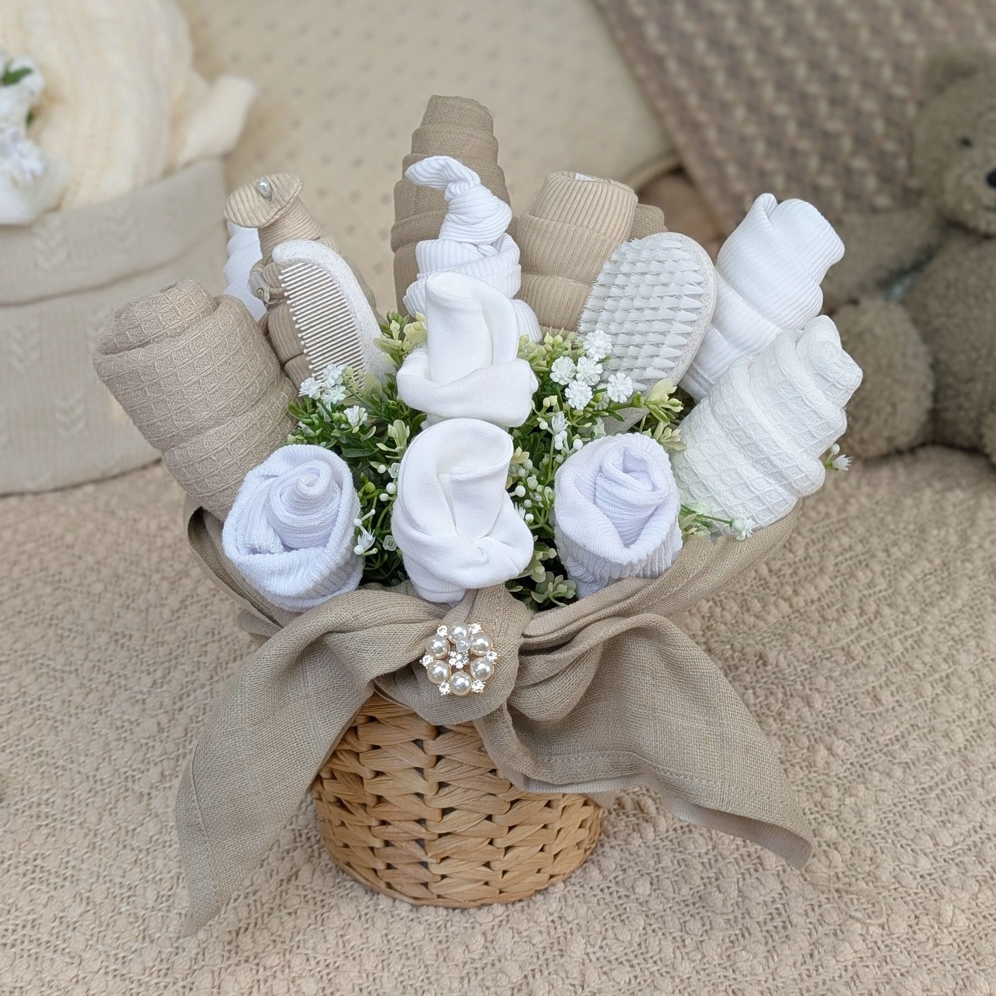 White flower baby bouquet made of baby clothes. bumbles and boo.