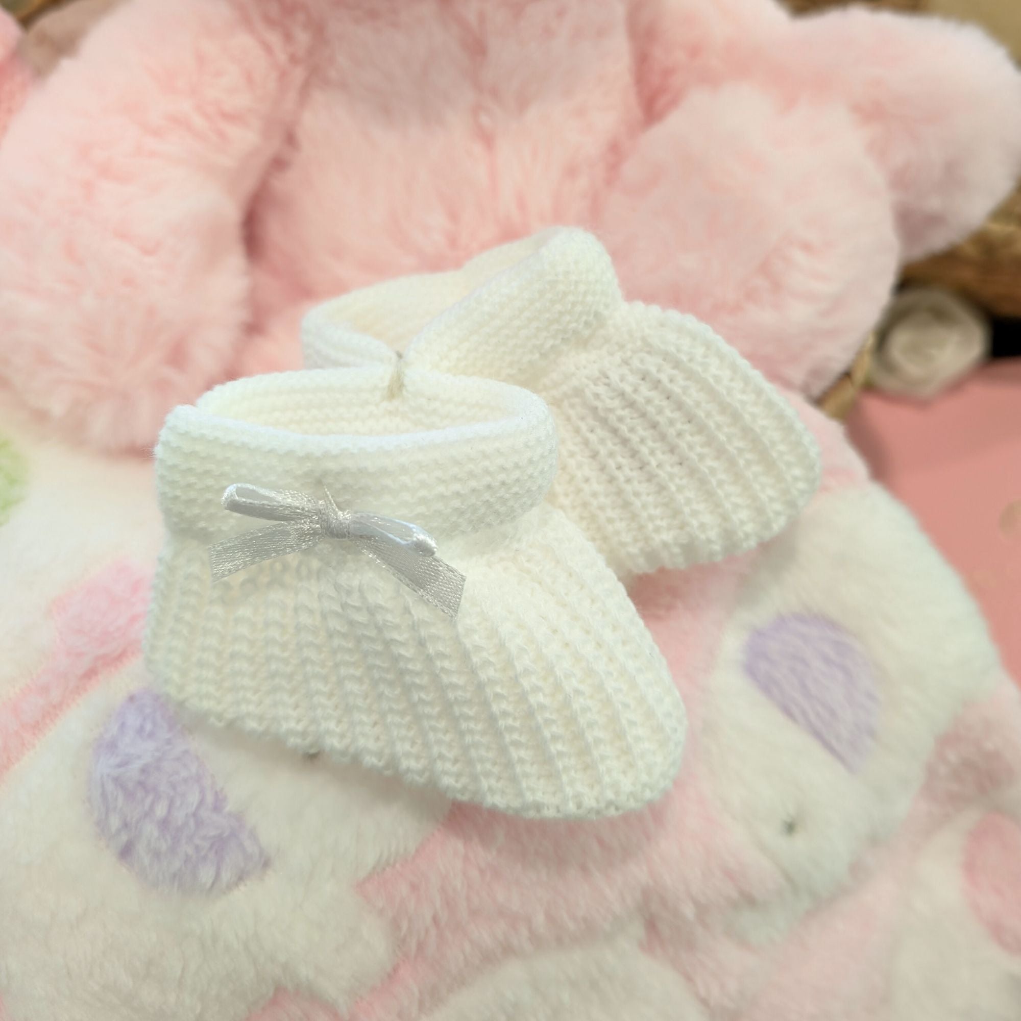 white knit baby booties.