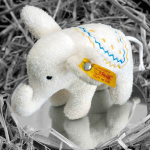 white mini elephant by Steiff with Steiff yellow ear tag with blue and yellow stitching