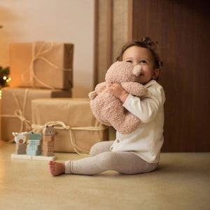 Cuddly Soft Toy Teddy Bear in Wild Rose sitting upright, made from soft boucle fabric