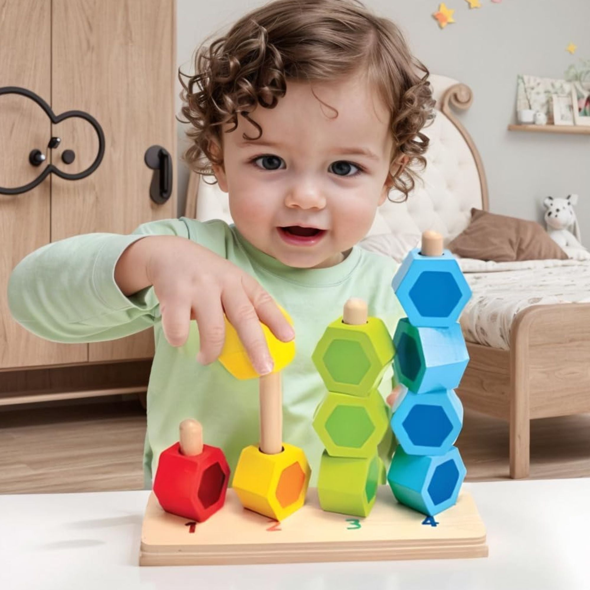 Wooden number counting stacker toy with bright colourful hexagonal blocks.