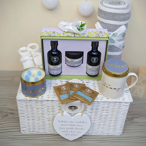 New mum hamper gift with baby blanket, soft toy, organic skincare, milestone cards, new mum mug and baby booties.