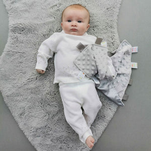 Baby clothes white knit outfit.